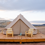 Regatta Bell Tent sandstone beige placed on platform with two chairs