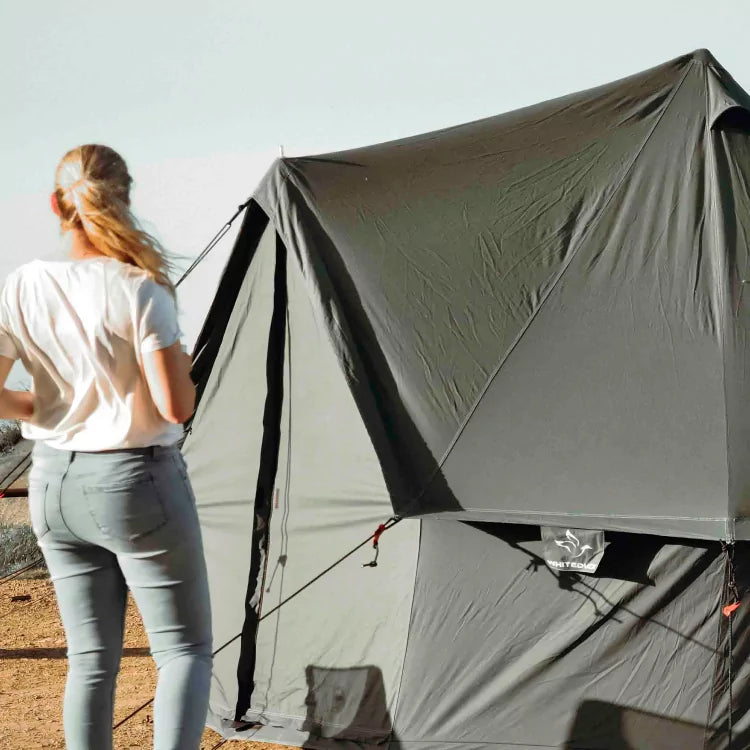 woman admiring the beauty of regatta bell tent