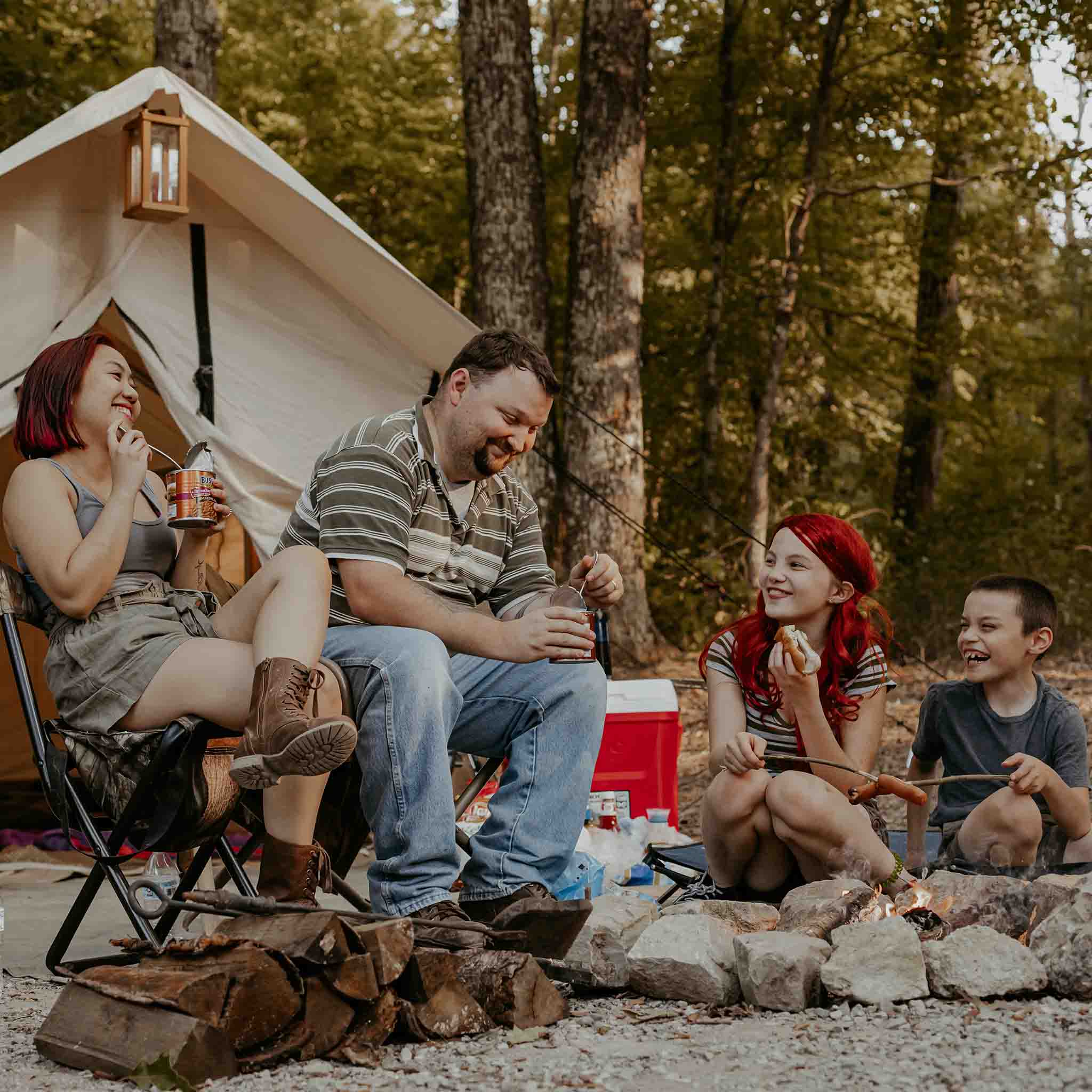 alpha wall tent with a family having a great time outdoors