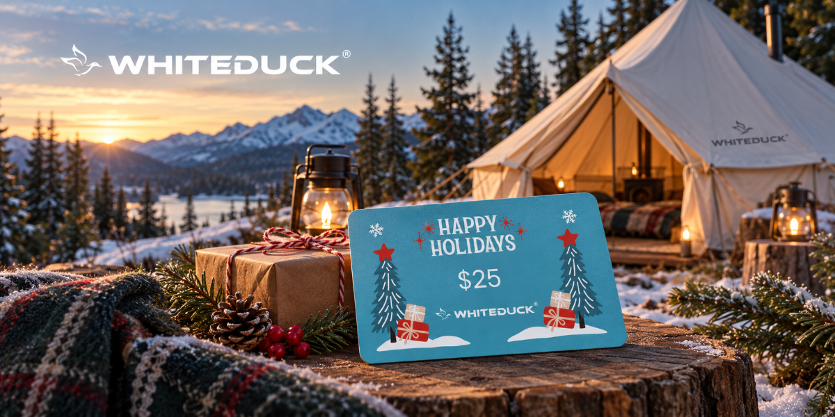 White Duck Outdoors camping gift card displayed with a cozy winter canvas tent