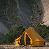 10 regatta bell tent tuscan sun in front of mountain with mesh grills closed