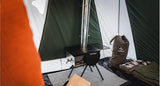 White Duck Outdoors Anchor Stove set up inside a canvas tent (sourced from Amazon listing)