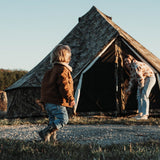 Regatta Bell Tent - Realtree Edge set up outdoors with a mother and her child playing outside