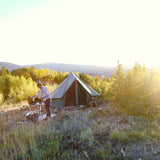 Regatta Bell Tent boulder grey with man cooking next to it