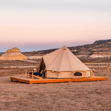 Regatta bell tent sandstone beige side view in sandy area on a platform