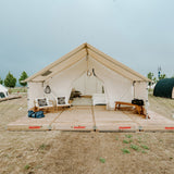 alpha pro wall tent set up on platform outdoors