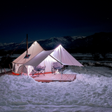 Avalon bell tent set outdoors in a lot of snow with chimney in the stove jack