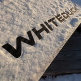 avalon bell tent in the snow with whiteduck logo 