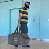 full Hoplite Canvas Parachute Bag being carried by a man